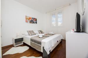 Postel nebo postele na pokoji v ubytování Apartman Bubli