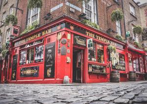 a red building on the side of a street at City 3 Bedroom Ensuited apartment with parking in Dublin