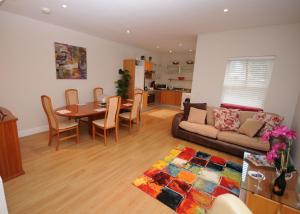 a living room with a table and a couch at 5 college crescent in Galway