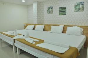 Postel nebo postele na pokoji v ubytování ADITI ROOMS