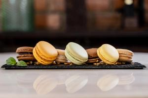 a plate of cookies and biscuits on a table at The Aviary Hotel in Siem Reap