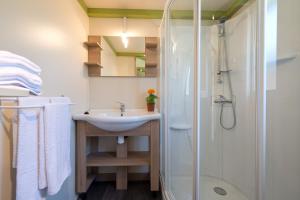 a bathroom with a sink and a shower at Camping Villasol in Benidorm