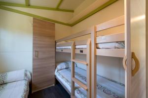 a bunk bed room with two bunk beds at Camping Villasol in Benidorm