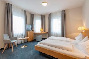 En eller flere senger på et rom på Hotel Gasthof Zum Rössle
