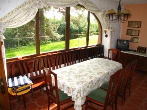 a dining room with a table and a window at Villa Blanka in Horní Podkozí