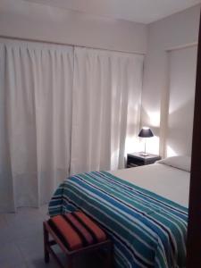 Una cama o camas en una habitación de Tu Lugar en Salta