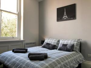 a bedroom with a bed with the eiffel tower at Fishergate ApartHotel 2 - City Centre Location in Preston