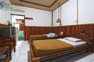 Hotel SAS Syariah客房内的一张或多张床位