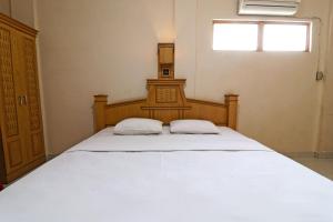 Hotel SAS Syariah客房内的一张或多张床位