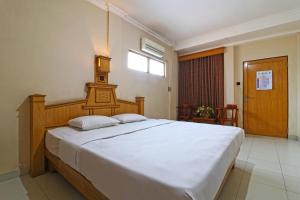 Hotel SAS Syariah客房内的一张或多张床位