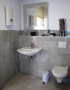 a bathroom with a sink and a toilet at Mosel - River - Quartier 31 in Lieser +65 photos