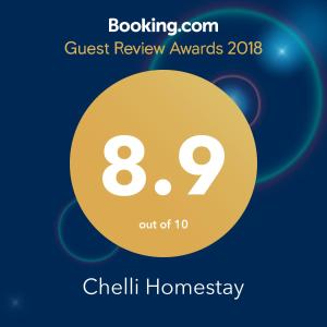 een gele cirkel met de wordsghost review awards chill homaway bij Chelli Homestay in Negombo