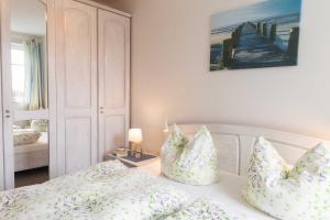 Ένα ή περισσότερα κρεβάτια σε δωμάτιο στο Appartement Residenz Bellevue Whg