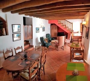 a living room with a table and chairs at B&B the lost Village el Acebuchal in Frigiliana