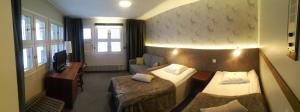 Ένα ή περισσότερα κρεβάτια σε δωμάτιο στο Hotel RokuanHovi