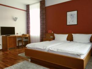 Postel nebo postele na pokoji v ubytování Hotel Ariston