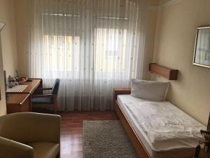 Postel nebo postele na pokoji v ubytování Hotel Ariston