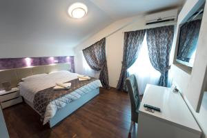 Postel nebo postele na pokoji v ubytování Hotel Oasis