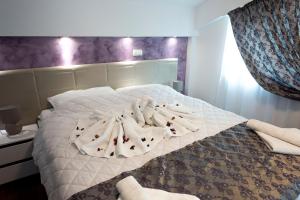 Postel nebo postele na pokoji v ubytování Hotel Oasis