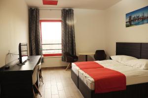 Postel nebo postele na pokoji v ubytování TOP HOTEL