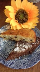 a sandwich with a flower on top of it at L'apparita Camere in Pienza