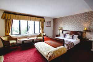 Voodi või voodid majutusasutuse Aherlow House Hotel & Lodges toas