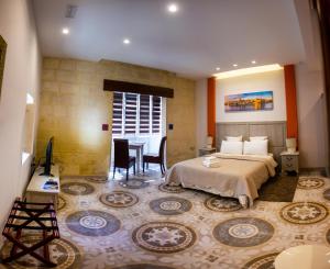 Postel nebo postele na pokoji v ubytování Casa Azzopardi Suites