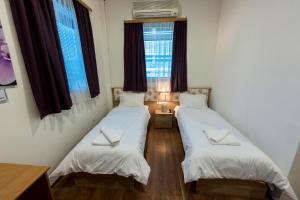 Postel nebo postele na pokoji v ubytování Hotel Oasis