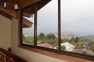 a large window with a view of a town at Boye House in Futrono