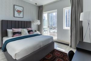 Ένα ή περισσότερα κρεβάτια σε δωμάτιο στο Wow! Super Luxury Apartment in Dubai Marina - 1BR RO