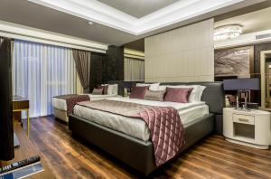 Katil atau katil-katil dalam bilik di Willmont Hotel