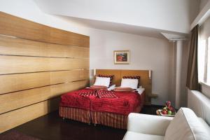 Giường trong phòng chung tại Hotel Epoque & Apartments