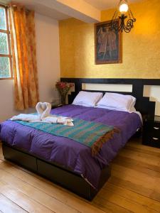 Katil atau katil-katil dalam bilik di Hostal Qolqampata