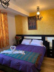 Katil atau katil-katil dalam bilik di Hostal Qolqampata