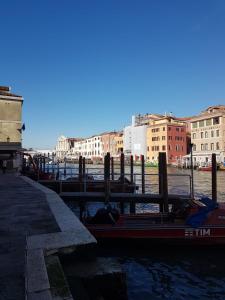 a boat is docked next to a dock at Corte dei Bari in Venice
