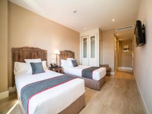Posteľ alebo postele v izbe v ubytovaní Hotel Altora + 37 fotografií