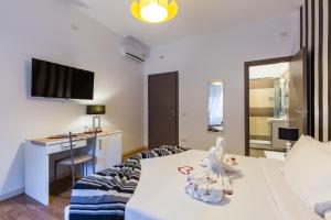 A television and/or entertainment centre at Rione Monti Suites