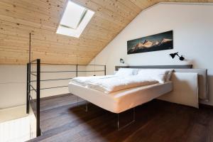 A bed or beds in a room at 21Barra5 Guest House