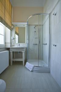 a bathroom with a shower and a sink at Hotel Masovia in Giżycko +30 photos