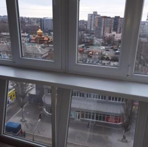 a view of a city from an office window at Апартаменты с панорамным видом на город in Zaporozhye