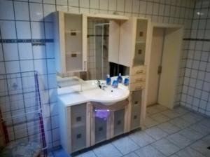 a bathroom with a sink and a mirror at Ferienwohnungen Untermühle, Rothenbergerstr. 12 in Altenau +73 photos