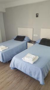 Postel nebo postele na pokoji v ubytování Guesthouse Central