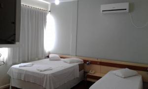 Postel nebo postele na pokoji v ubytování Hotel Premier