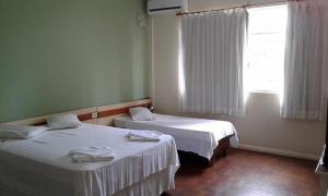 Postel nebo postele na pokoji v ubytování Hotel Premier