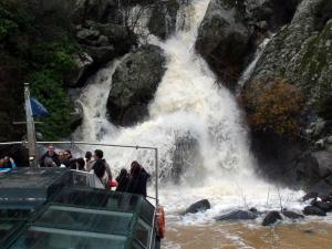 a group of people on a boat in a waterfall at Casa de l Bárrio in Picote