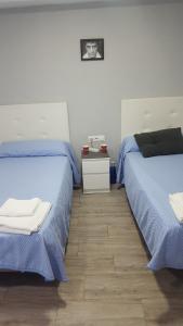 Postel nebo postele na pokoji v ubytování Guesthouse Central