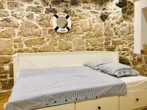 Postel nebo postele na pokoji v ubytování APARTMAN Captain Bervida Murter