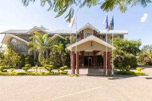 a building with flags in front of it at Fahari Gardens Hotel in Nairobi