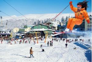 a group of people on a ski slope with a person on skis at PALACE KIRKPINAR in Sakarya