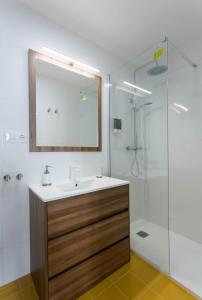 a bathroom with a sink and a shower at Luxury apartment-free parking in Santiago de Compostela